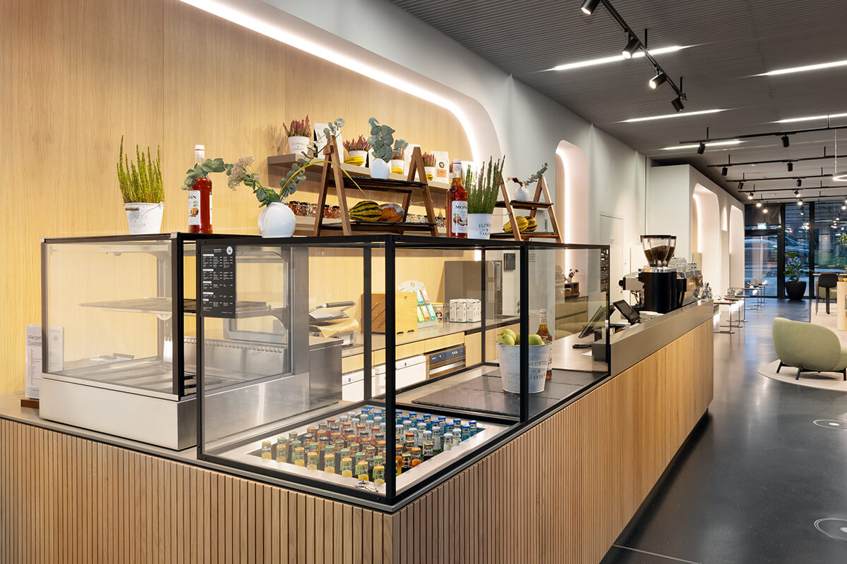 Office interior with barista bar, seating niches and open architecture, designed and built by Display International as general contractor.