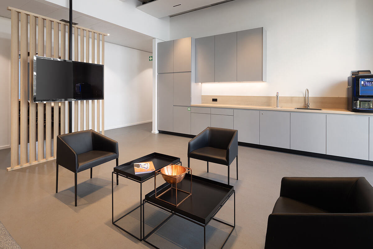 Interior finishing of office spaces: inviting kitchens for employees and break rooms.