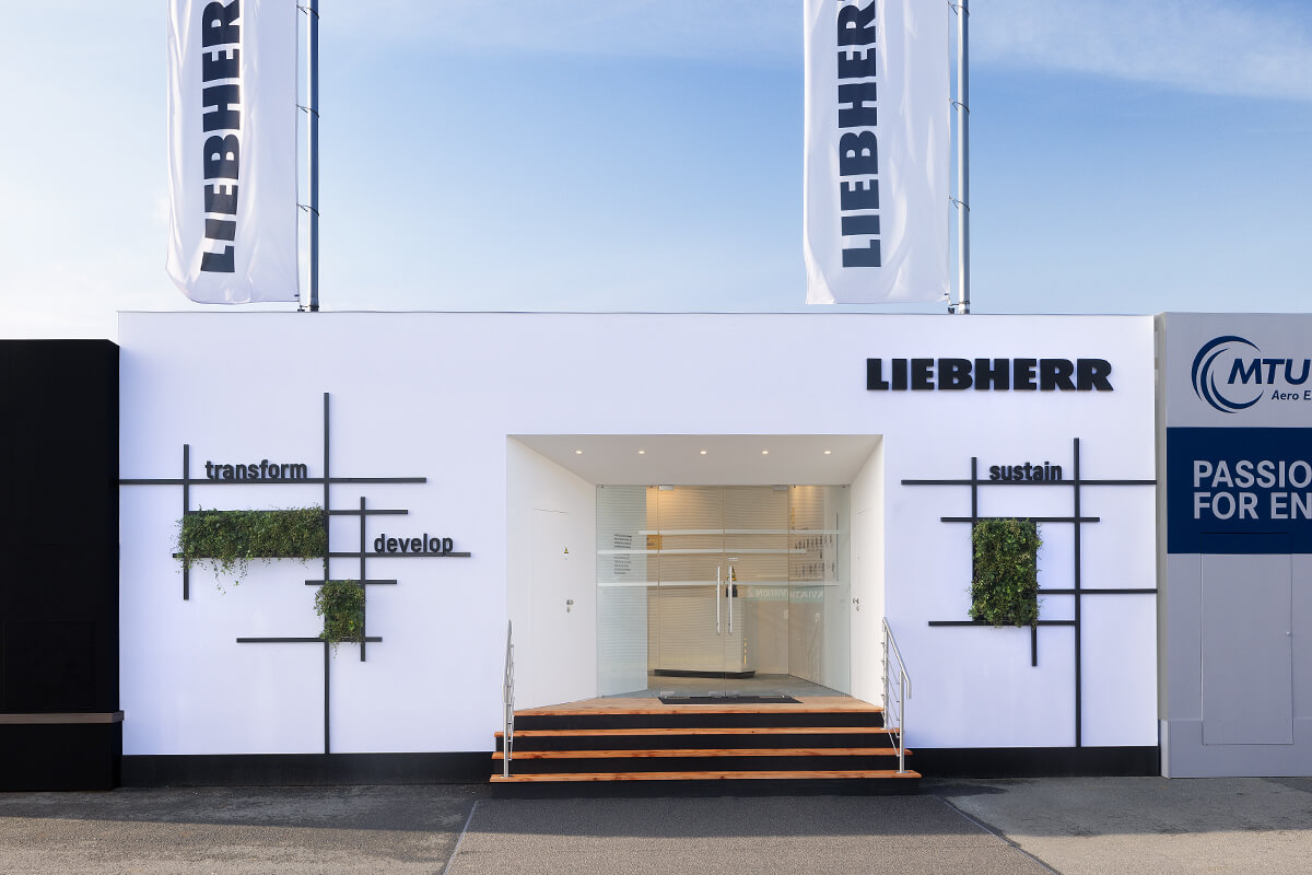 Outdoor exhibition stand for Liebherr at the ILA in Berlin realized by the exhibition construction company Display International.